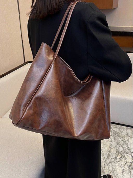 Bolso tipo bucket de cuero suave de gran capacidad