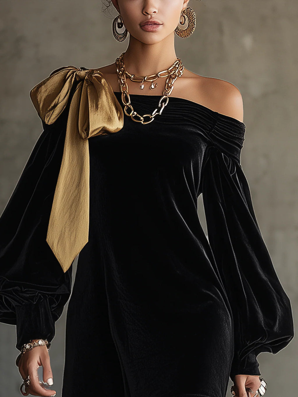 Mini vestido negro de terciopelo con lazo de satén dorado
