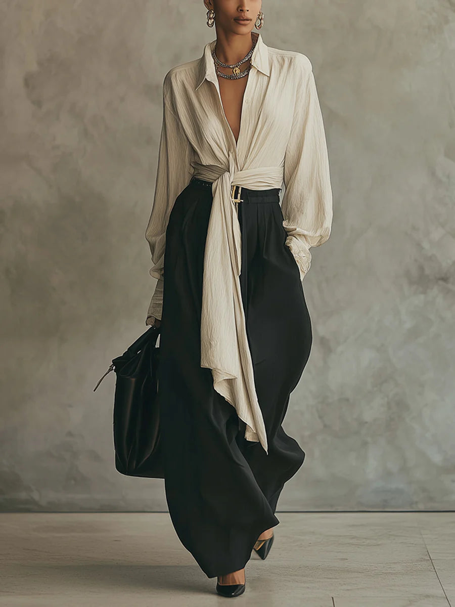 Conjunto de camisa beige con cordones y pantalón negro