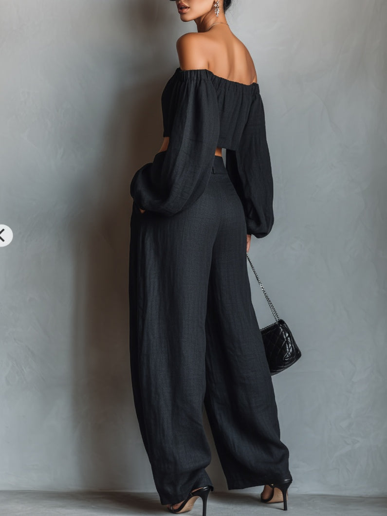 Conjunto negro de top con hombros descubiertos y pantalón ancho