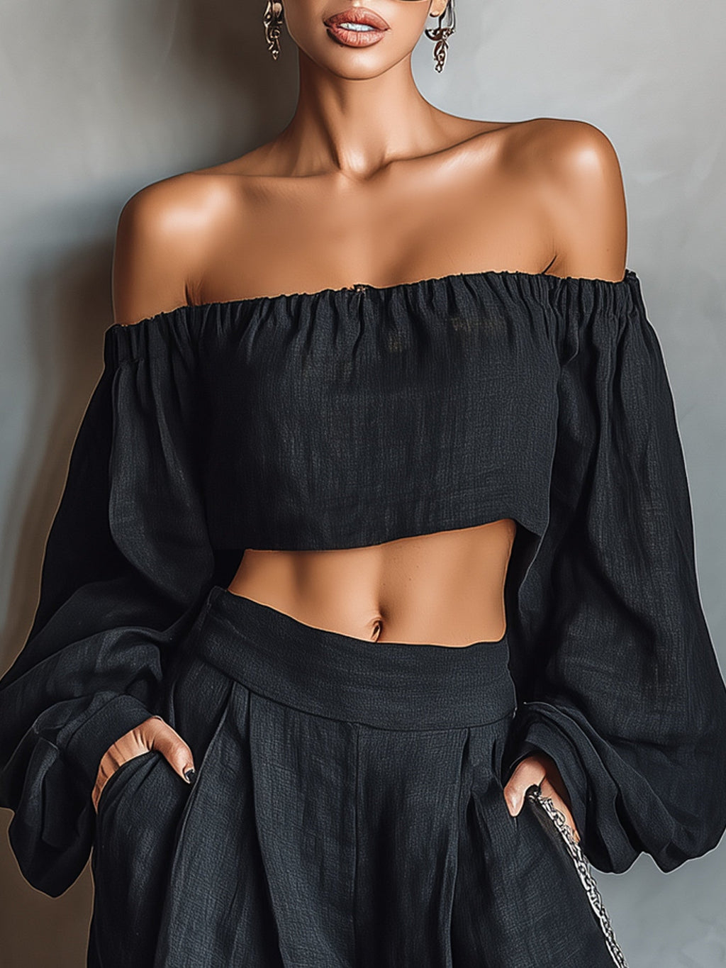 Conjunto negro de top con hombros descubiertos y pantalón ancho