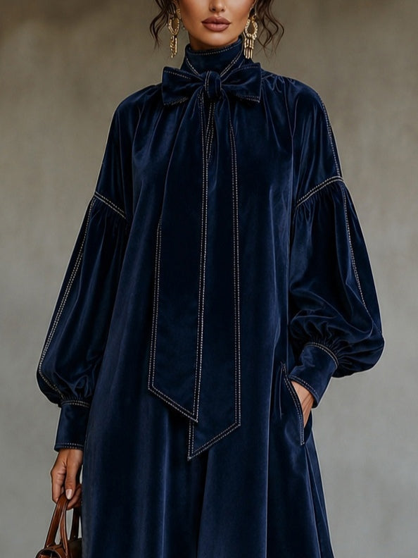 Vestido midi de terciopelo azul marino con lazo y mangas abullonadas