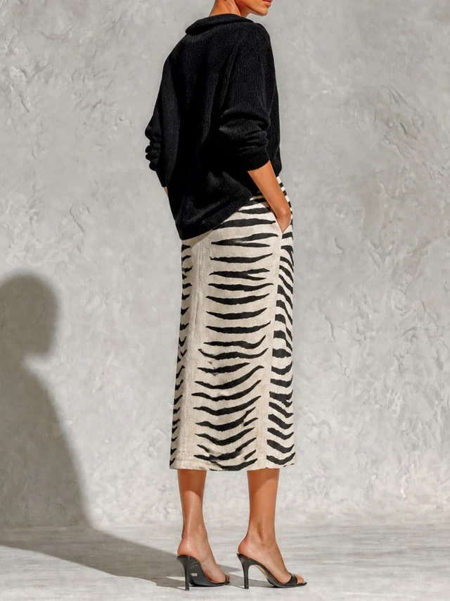 Conjunto negro de top de punto y falda midi de cebra