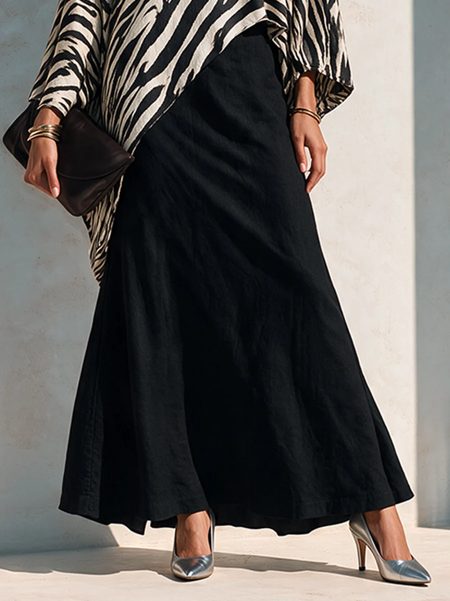 Conjunto de top asimétrico con estampado de cebra y falda negra drapeada