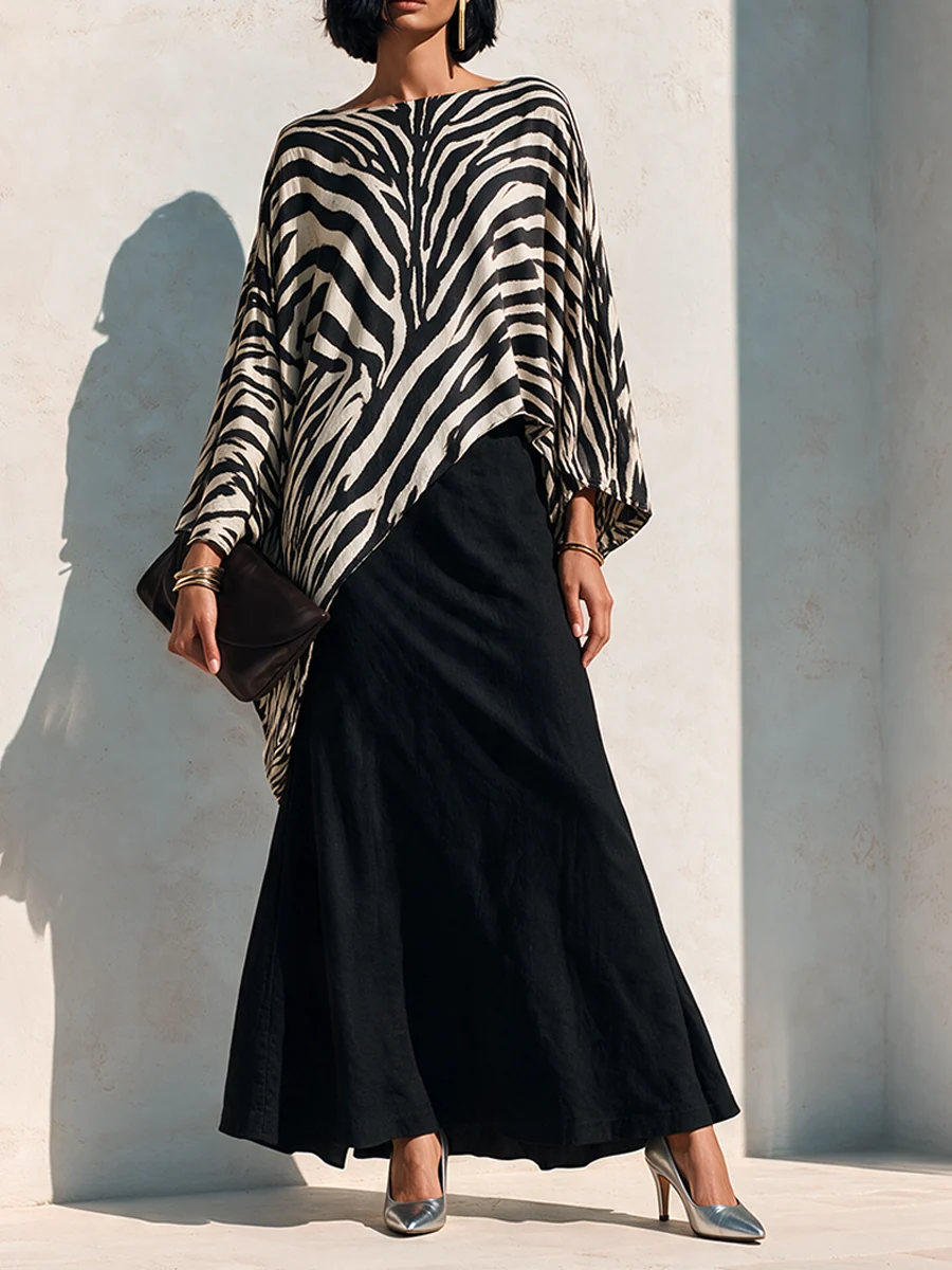 Conjunto de top asimétrico con estampado de cebra y falda negra drapeada