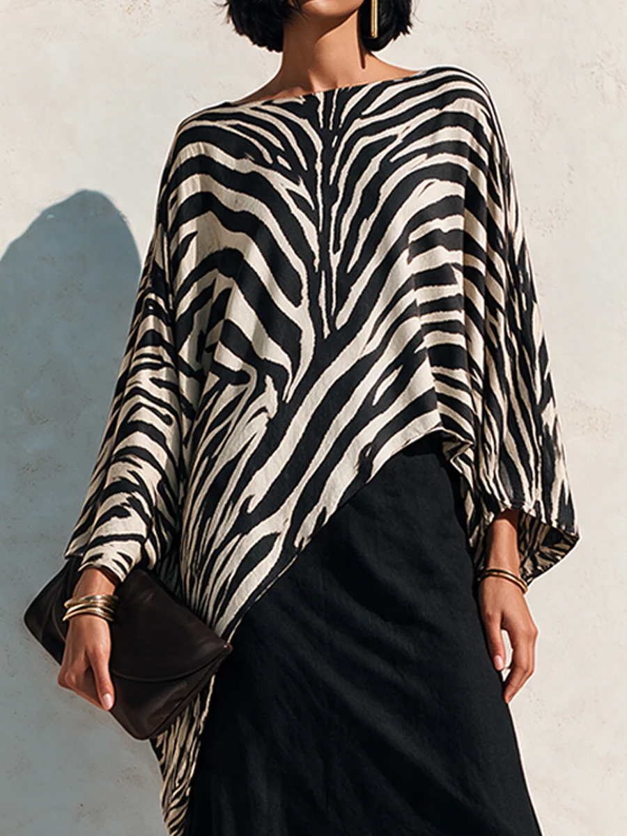 Conjunto de top asimétrico con estampado de cebra y falda negra drapeada