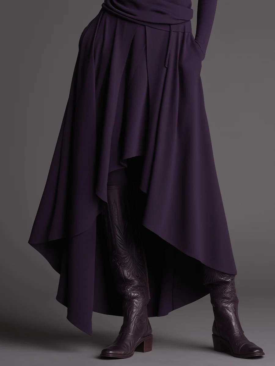 Conjunto morado de top con cuello alto y falda asimétrica