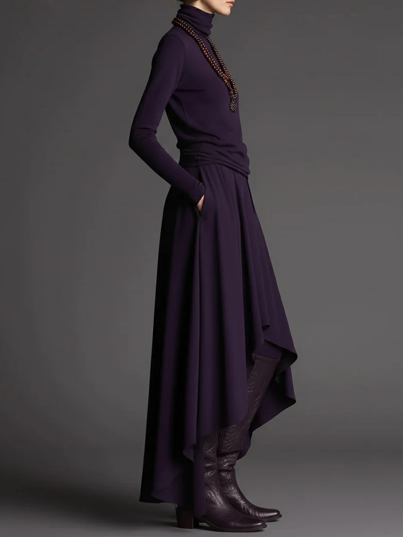 Conjunto morado de top con cuello alto y falda asimétrica