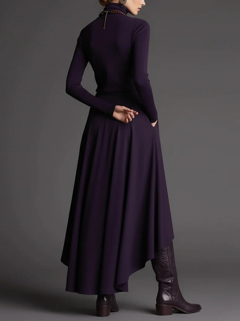 Conjunto morado de top con cuello alto y falda asimétrica