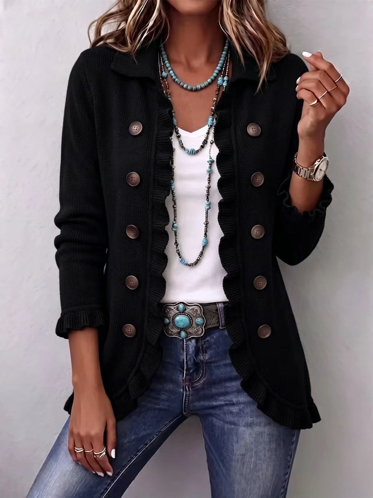 Chaqueta de punto negra con volantes