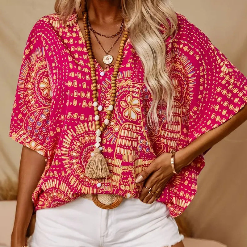 Top vacacional holgado para mujer con cuello de pico, estampado y mangas murciélago