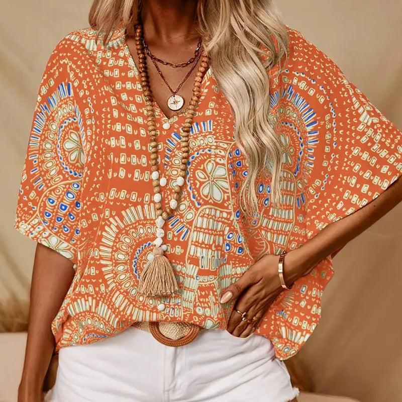 Top vacacional holgado para mujer con cuello de pico, estampado y mangas murciélago