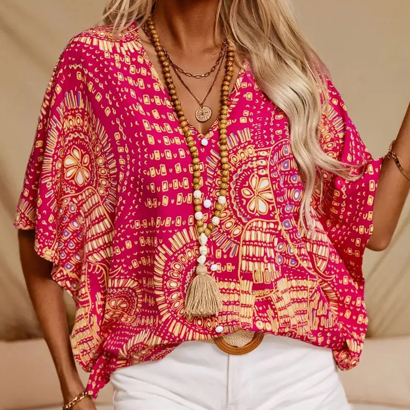Top vacacional holgado para mujer con cuello de pico, estampado y mangas murciélago