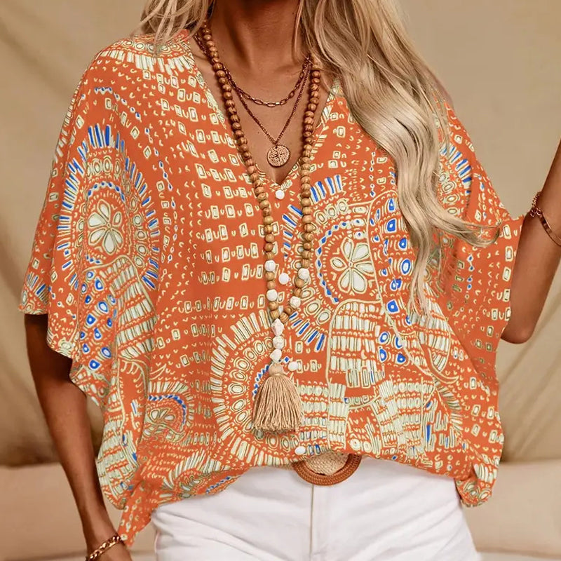 Top vacacional holgado para mujer con cuello de pico, estampado y mangas murciélago