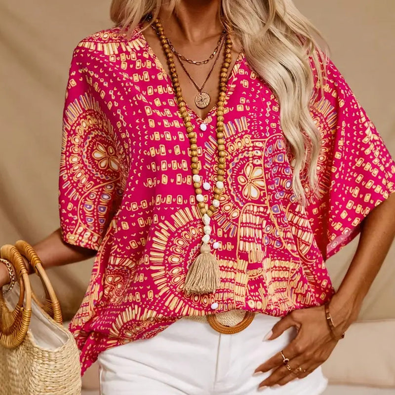 Top vacacional holgado para mujer con cuello de pico, estampado y mangas murciélago